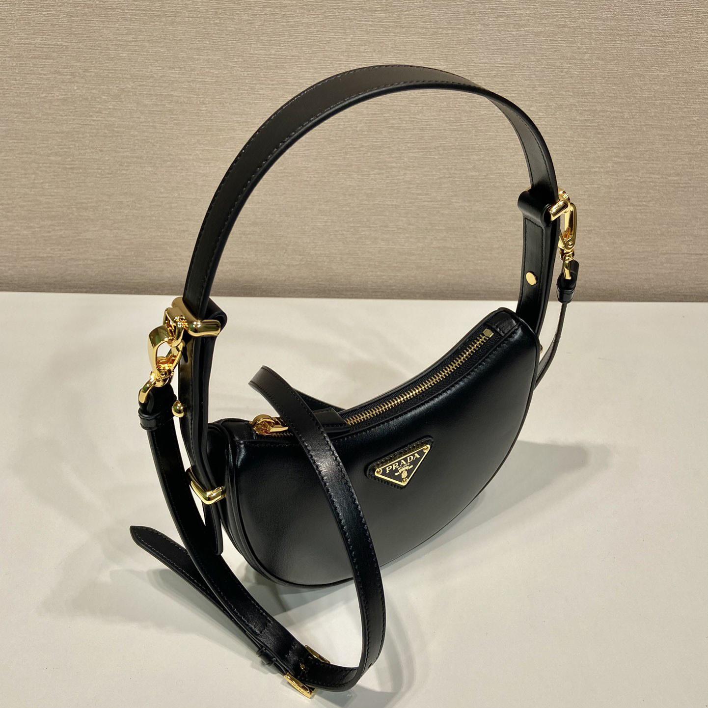 Prada Arqué Leather Mini Shoulder Bag - FashionPlug