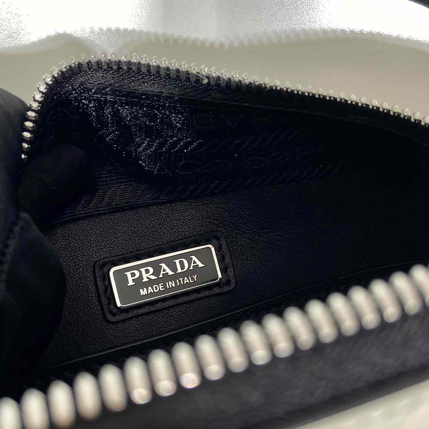 Prada Brique Brushed Leather Bag With Triangle Motif - FashionPlug