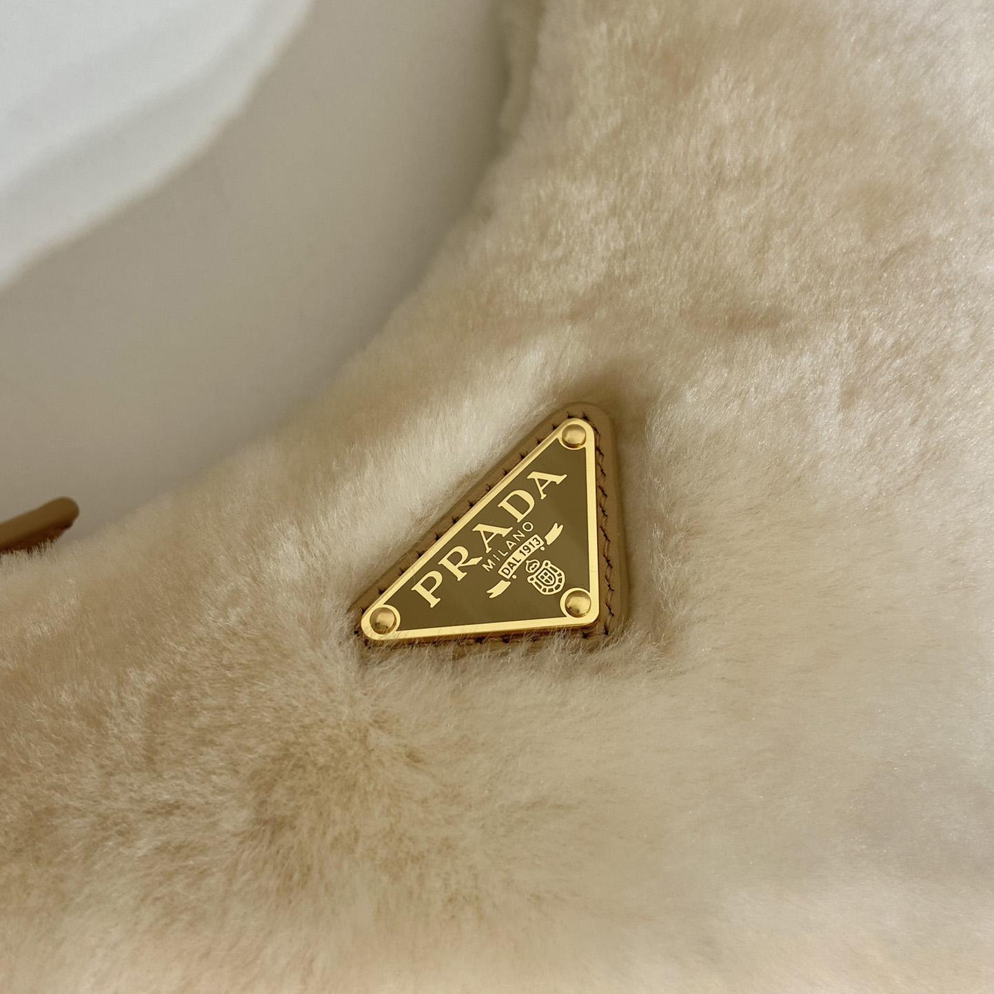 Prada Arqué Shearling And Leather Shoulder Bag - FashionPlug