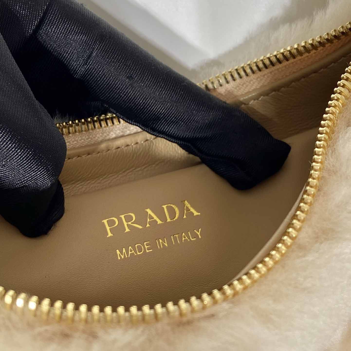 Prada Arqué Shearling And Leather Shoulder Bag - FashionPlug