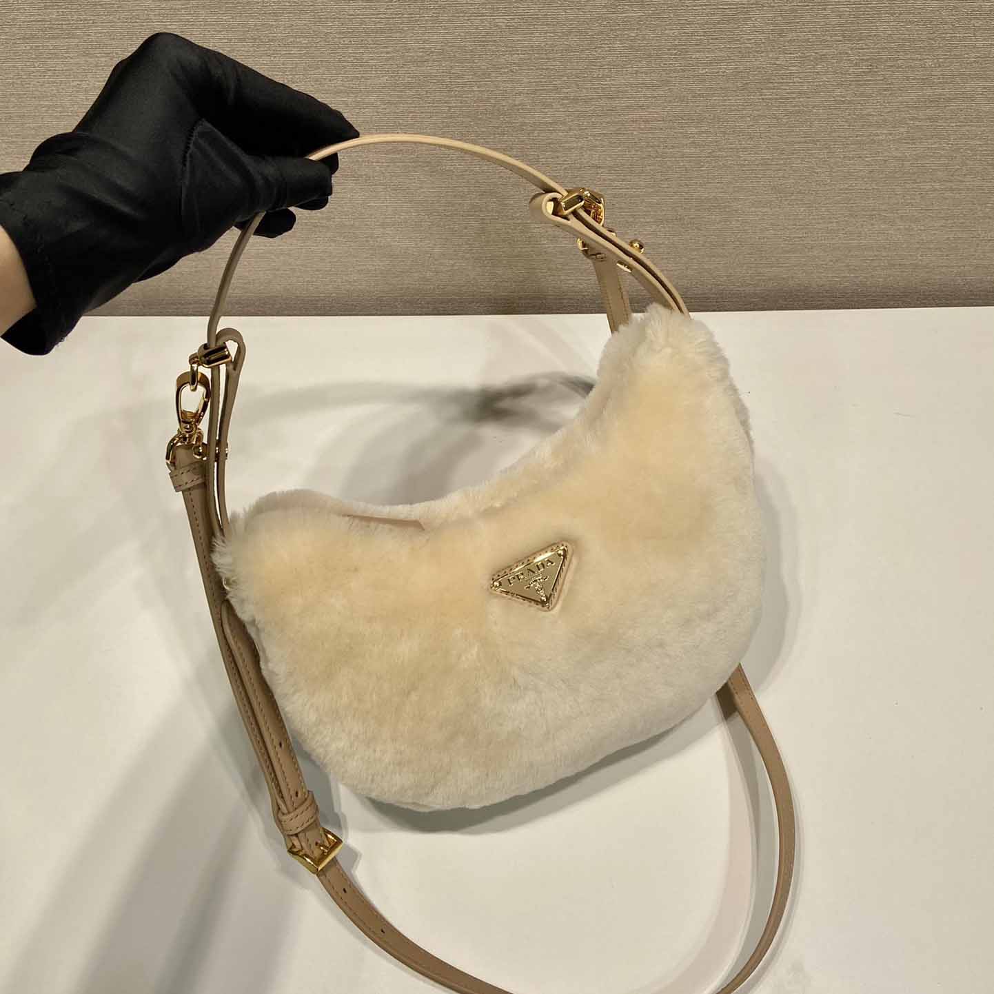 Prada Arqué Shearling And Leather Shoulder Bag - FashionPlug