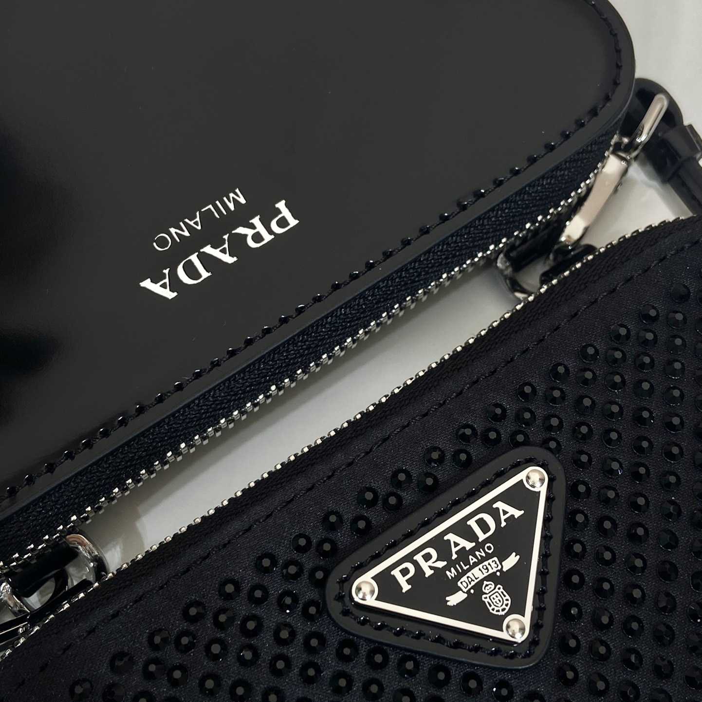 Prada Triangular Embellished Satin And Leather Mini-pouch - FashionPlug