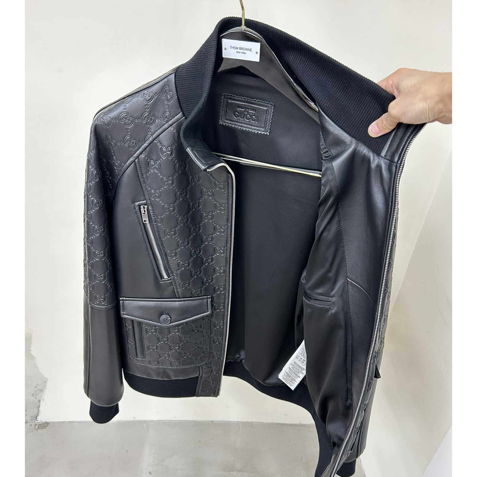 Gucci GG Embossed Bomber Jacket In Black - FashionPlug