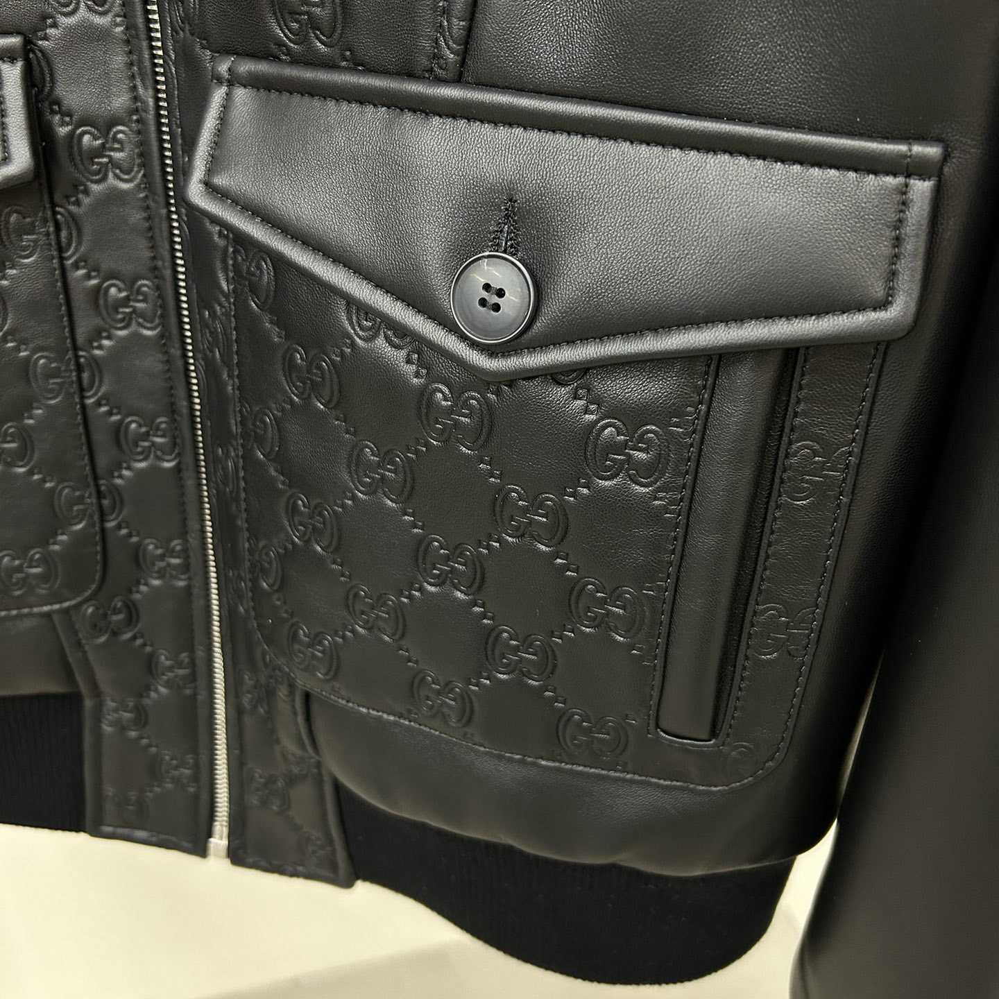 Gucci GG Embossed Bomber Jacket In Black - FashionPlug