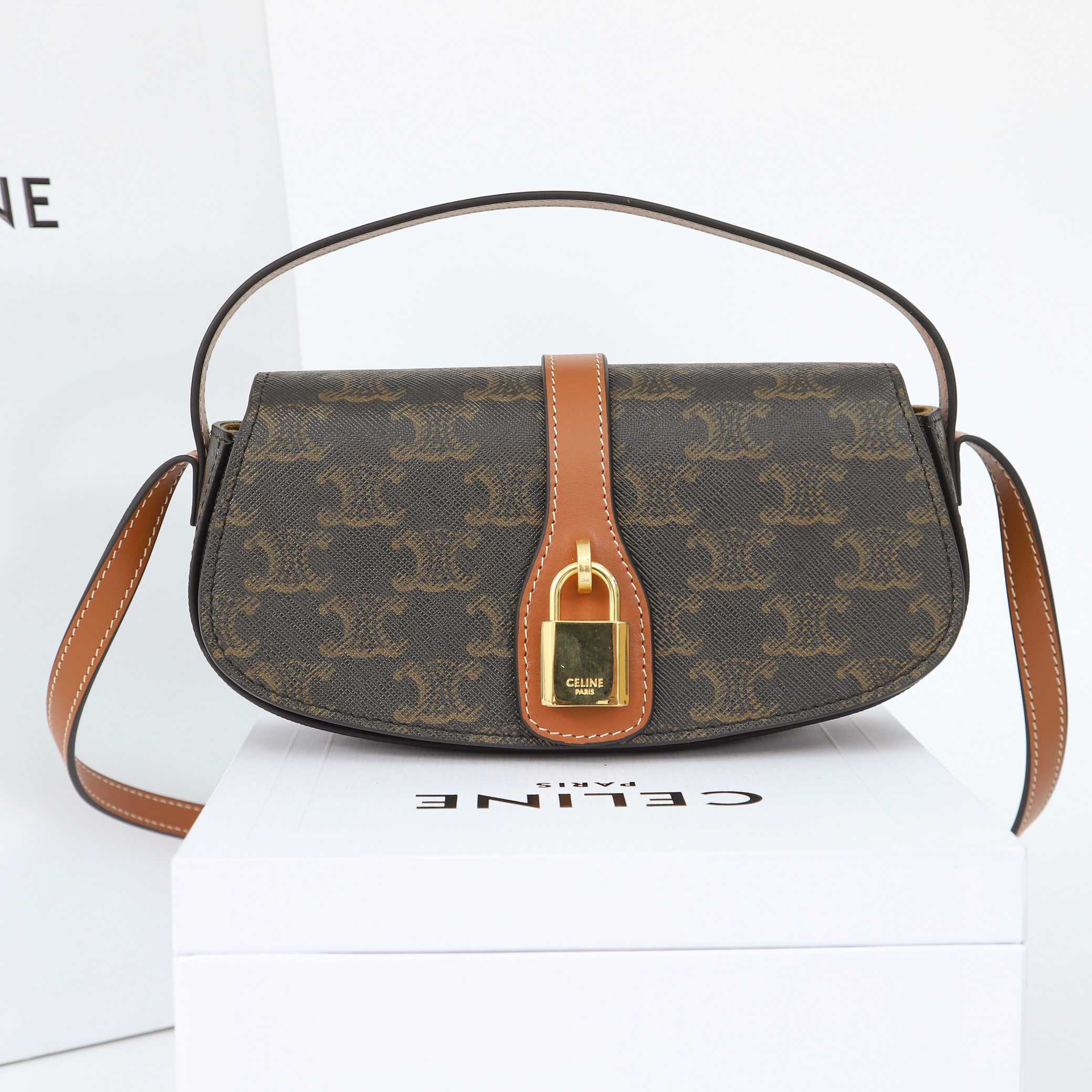 Celine Clutch On Strap Tabou In Triomphe Canvas And Calfskin - FashionPlug