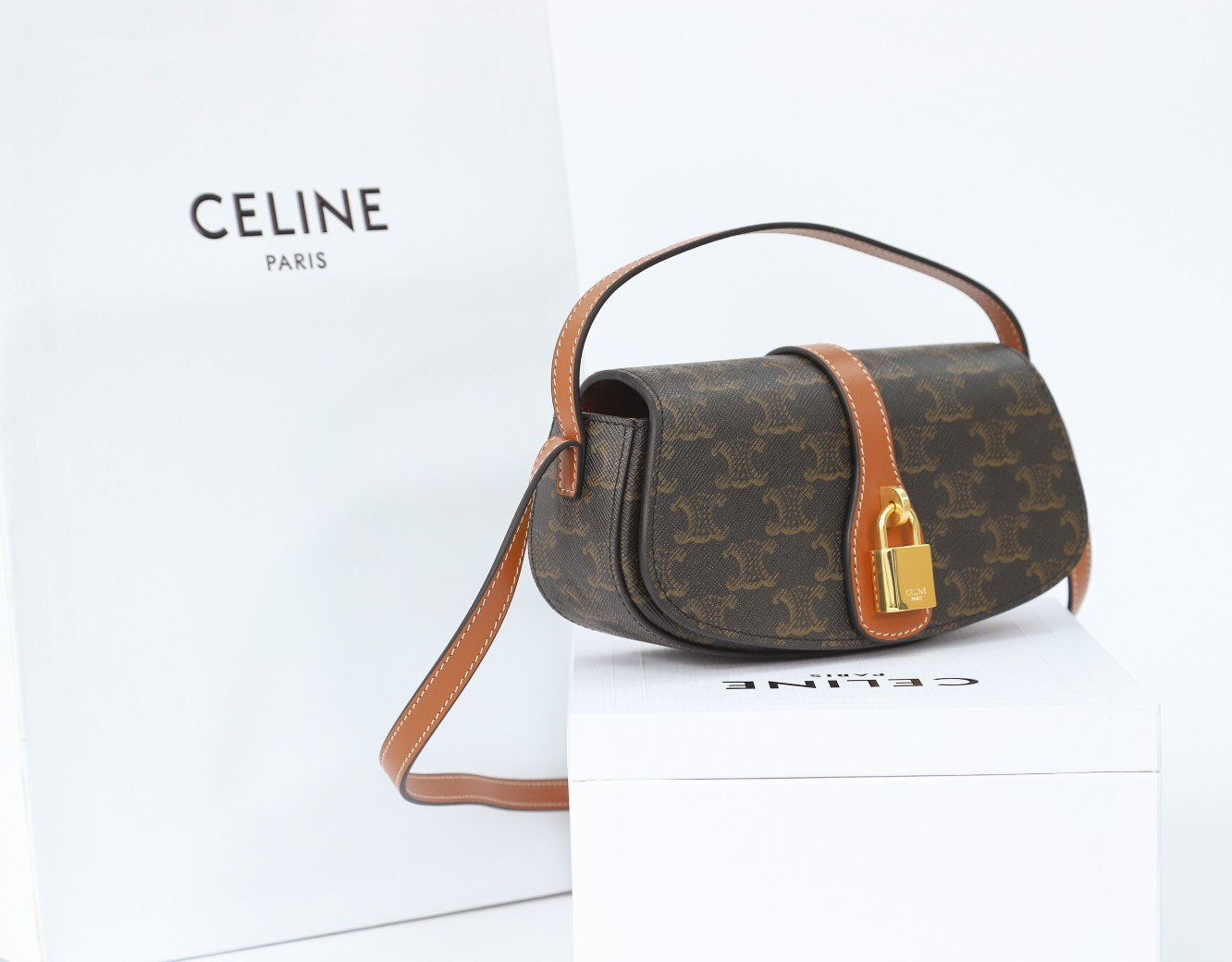 Celine Clutch On Strap Tabou In Triomphe Canvas And Calfskin - FashionPlug