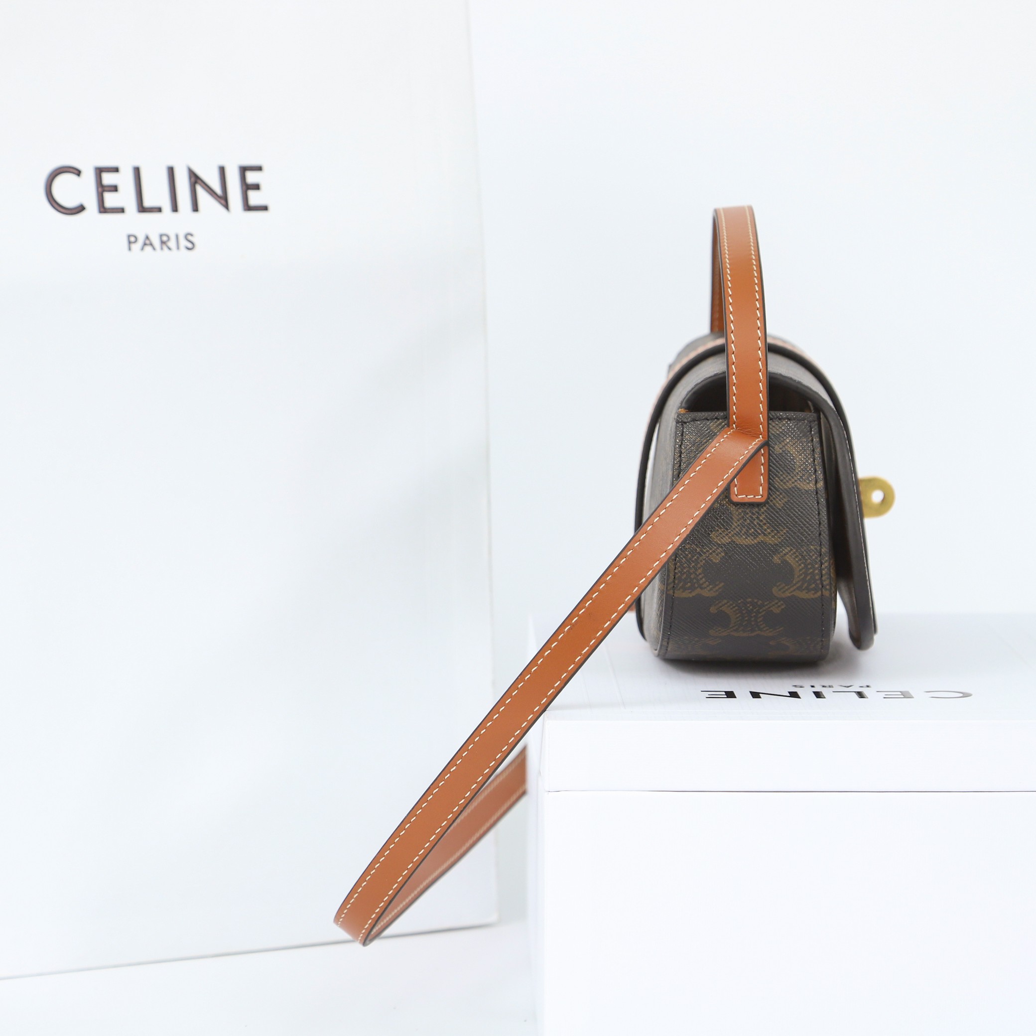 Celine Clutch On Strap Tabou In Triomphe Canvas And Calfskin - FashionPlug