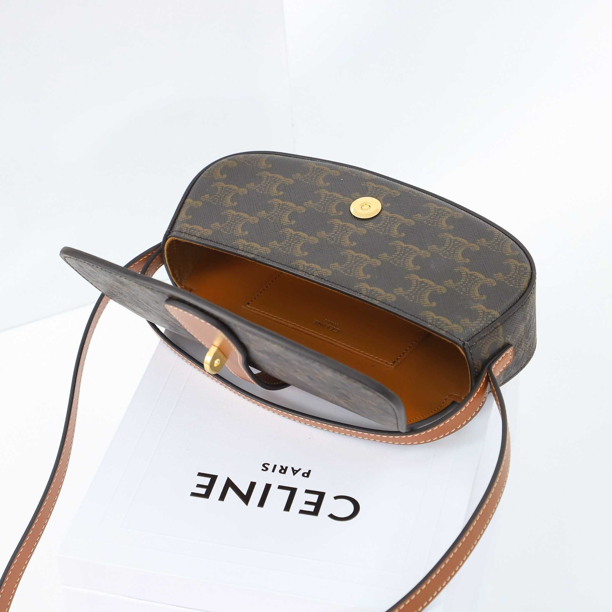 Celine Clutch On Strap Tabou In Triomphe Canvas And Calfskin - FashionPlug