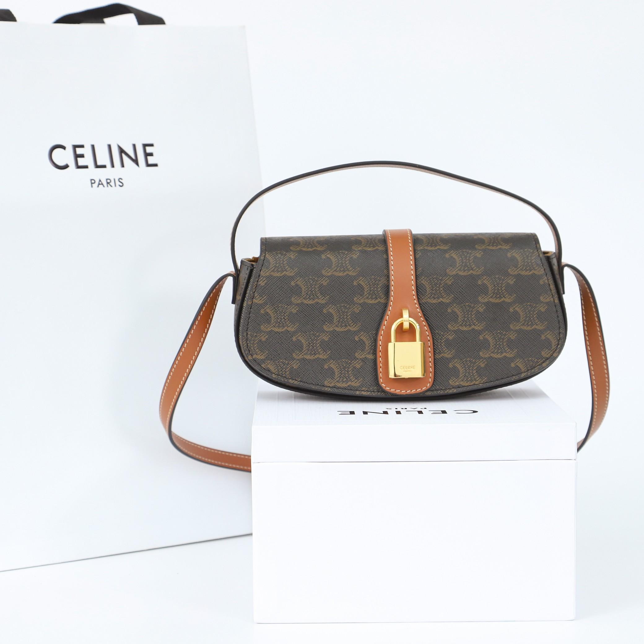 Celine Clutch On Strap Tabou In Triomphe Canvas And Calfskin - FashionPlug