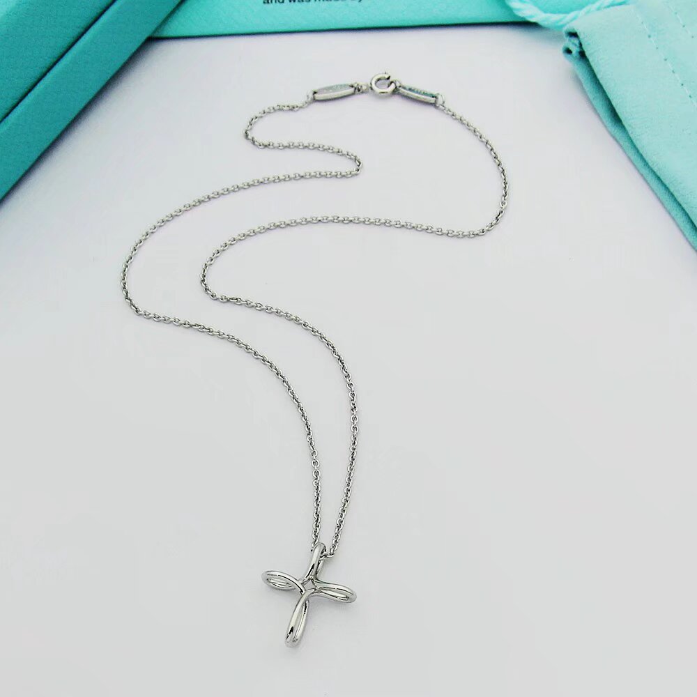 Tiffany & Co. Infinity Cross Pendant - FashionPlug