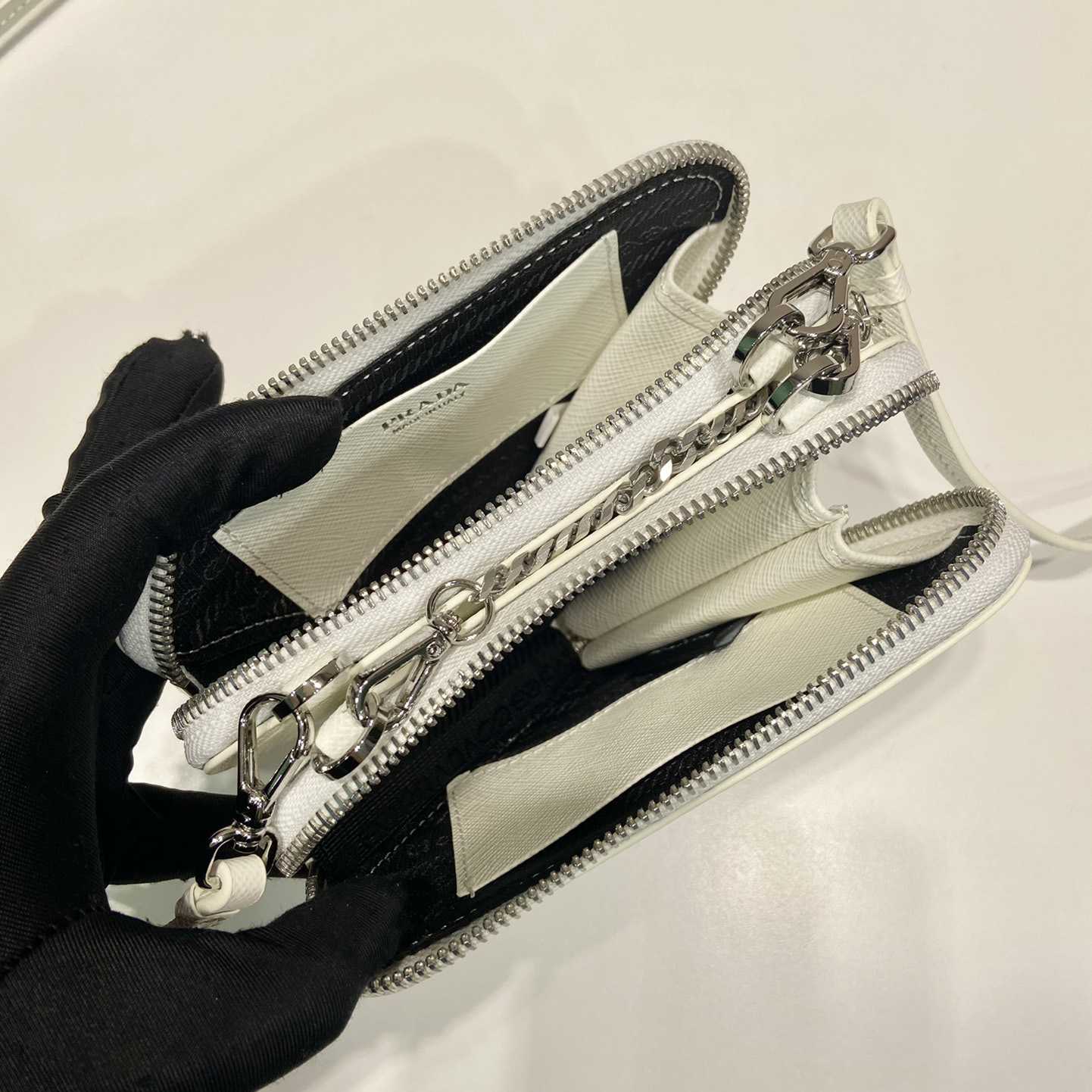 Prada Triangular Embellished Satin And Leather Mini-pouch - FashionPlug