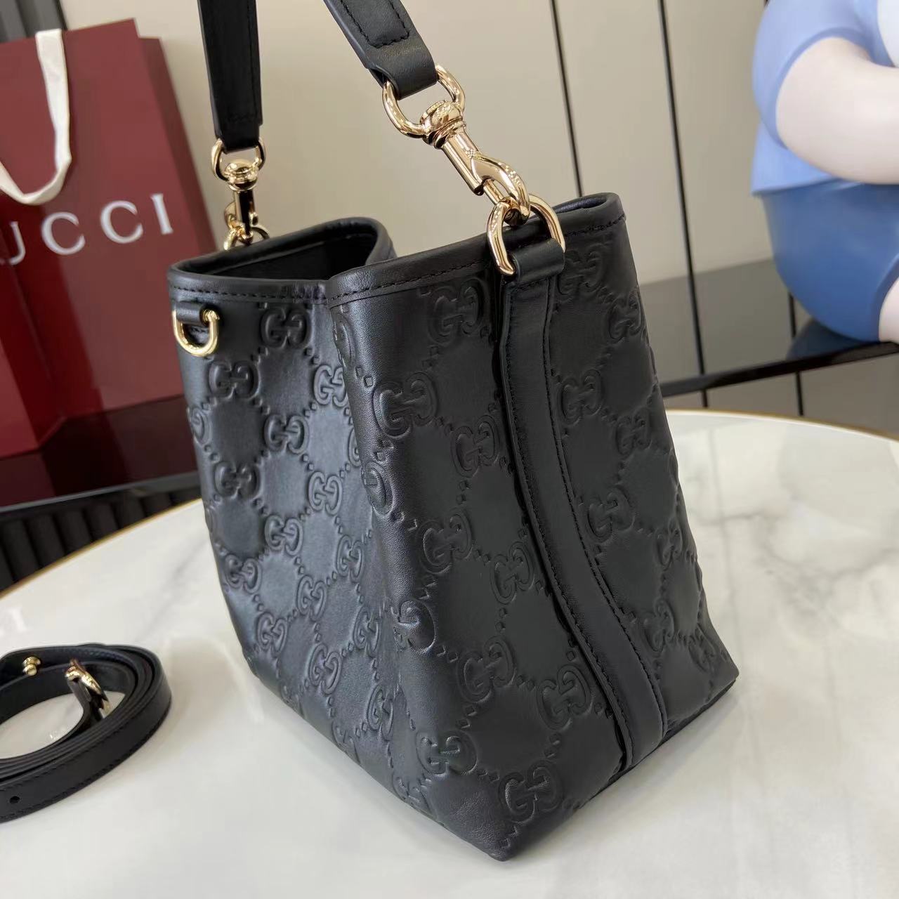 Gucci GG Emblem Small Bucket Bag  - FashionPlug