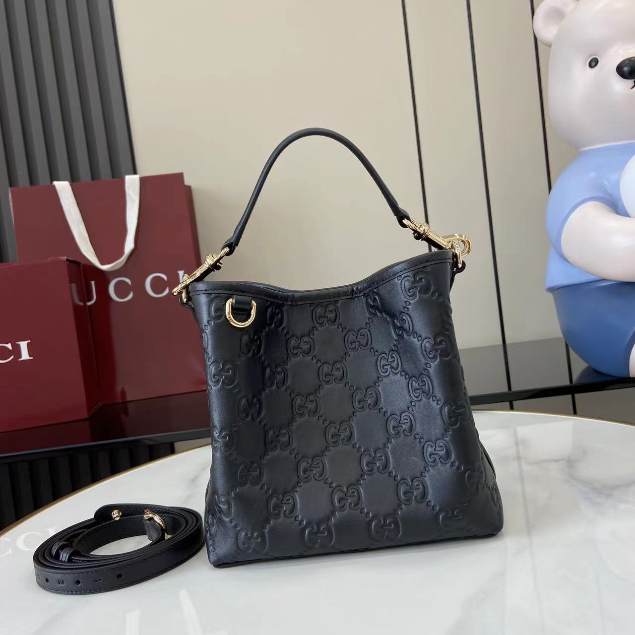 Gucci GG Emblem Small Bucket Bag  - FashionPlug