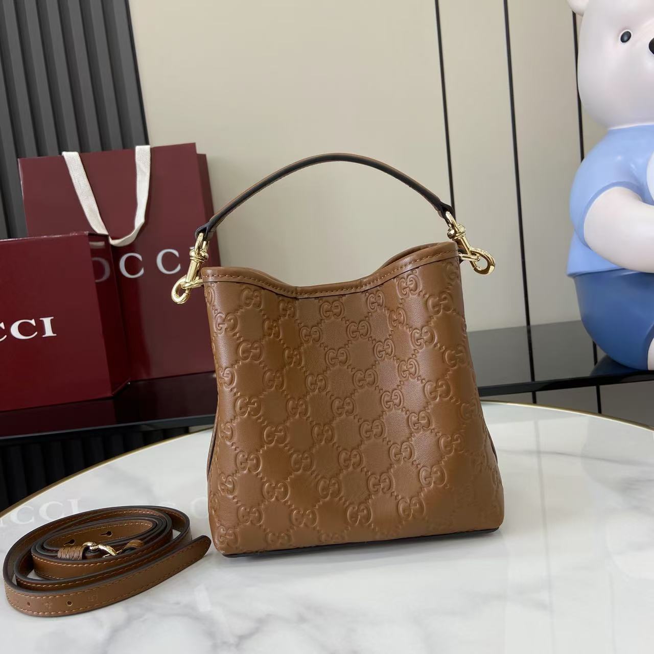 Gucci GG Emblem Small Bucket Bag  - FashionPlug