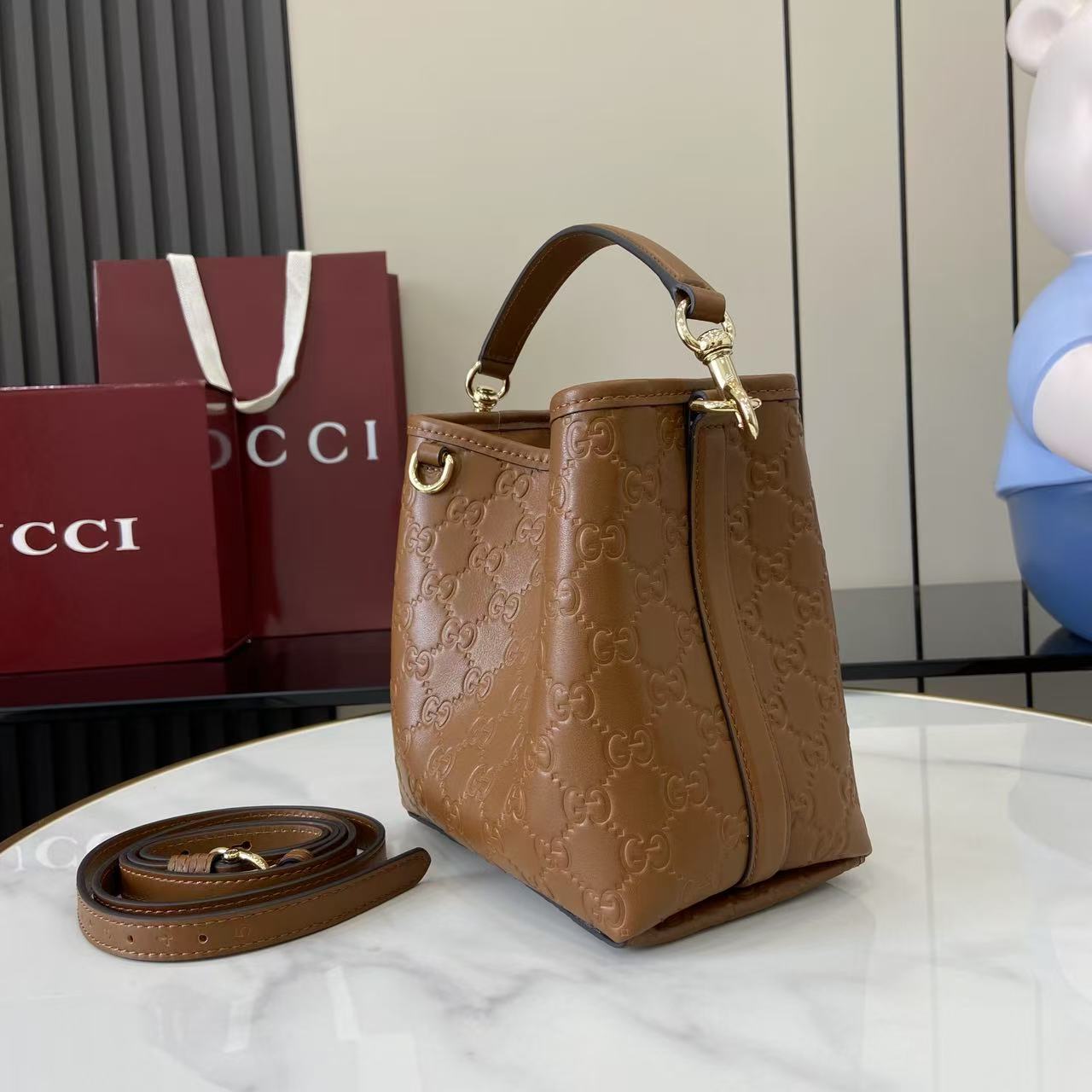 Gucci GG Emblem Small Bucket Bag  - FashionPlug
