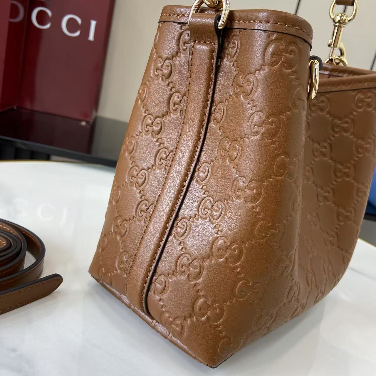 Gucci GG Emblem Small Bucket Bag  - FashionPlug