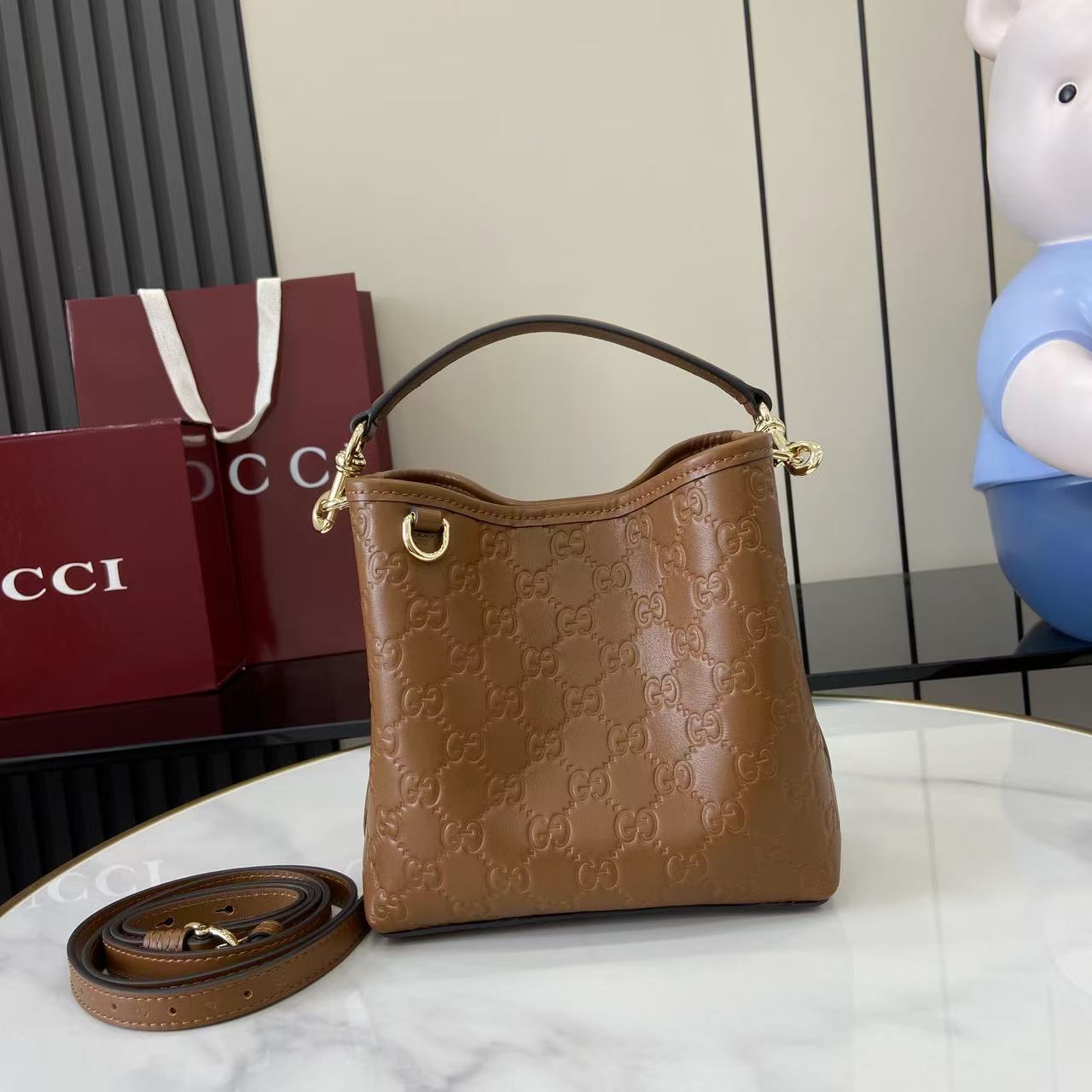 Gucci GG Emblem Small Bucket Bag  - FashionPlug