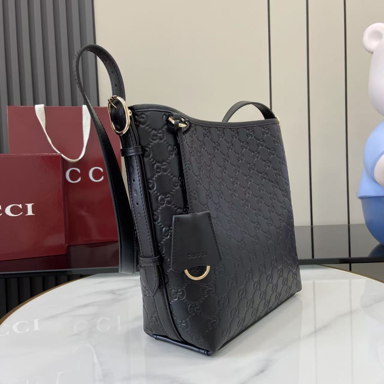 Gucci GG Emblem Small Shoulder Bag - FashionPlug