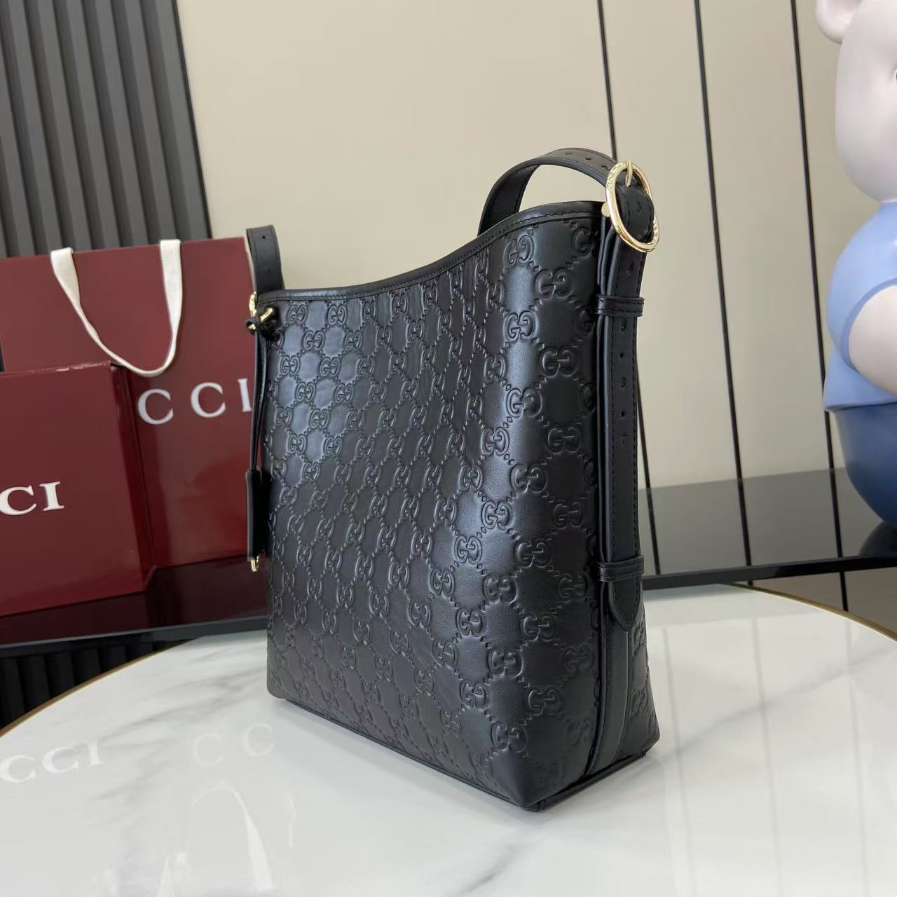 Gucci GG Emblem Small Shoulder Bag - FashionPlug
