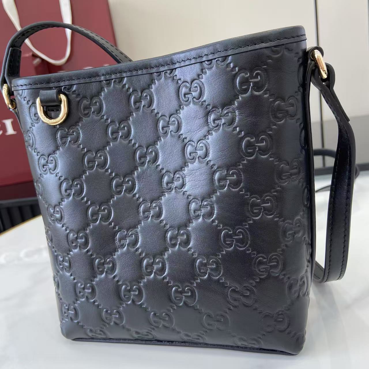 Gucci GG Emblem Nano Bucket Bag - FashionPlug