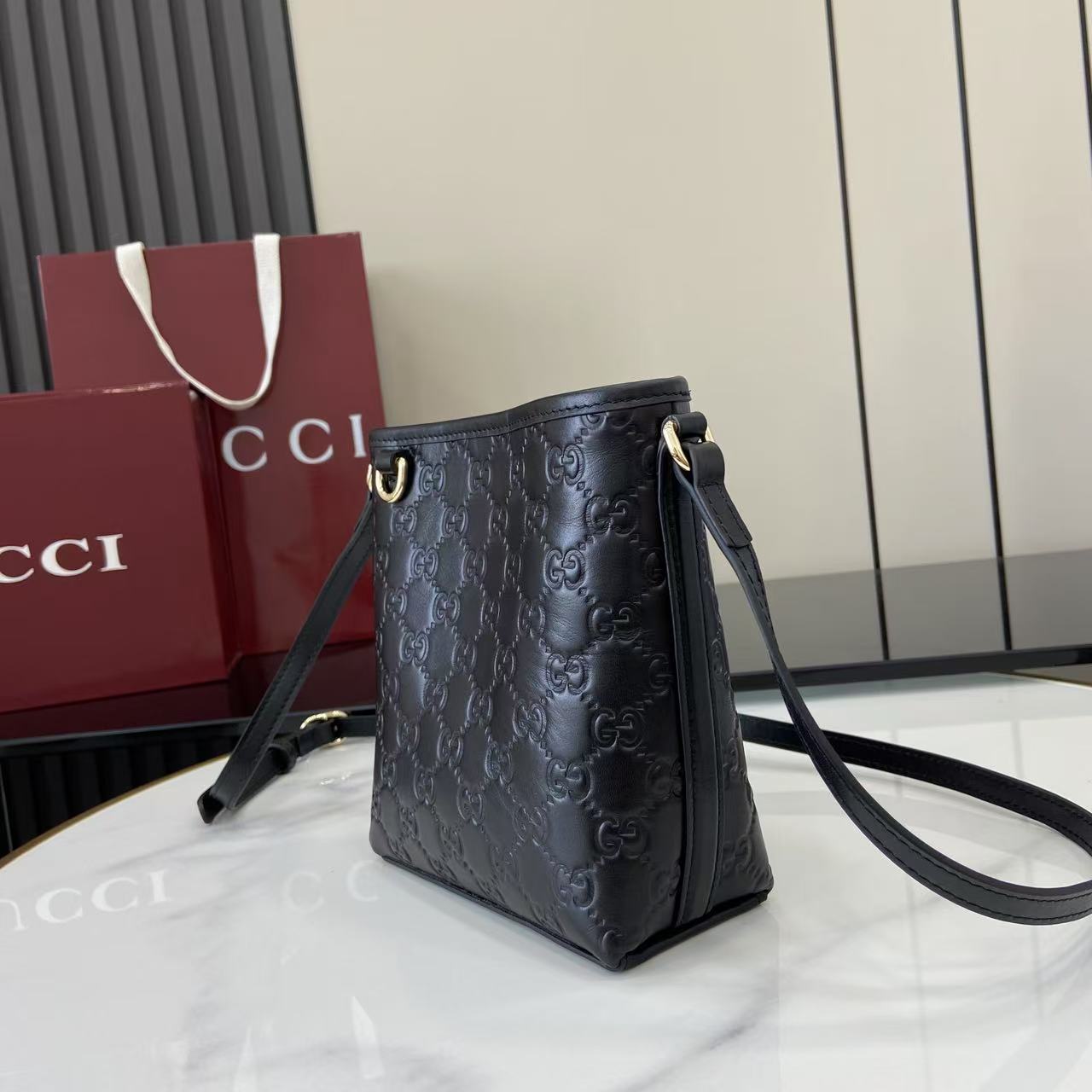 Gucci GG Emblem Nano Bucket Bag - FashionPlug