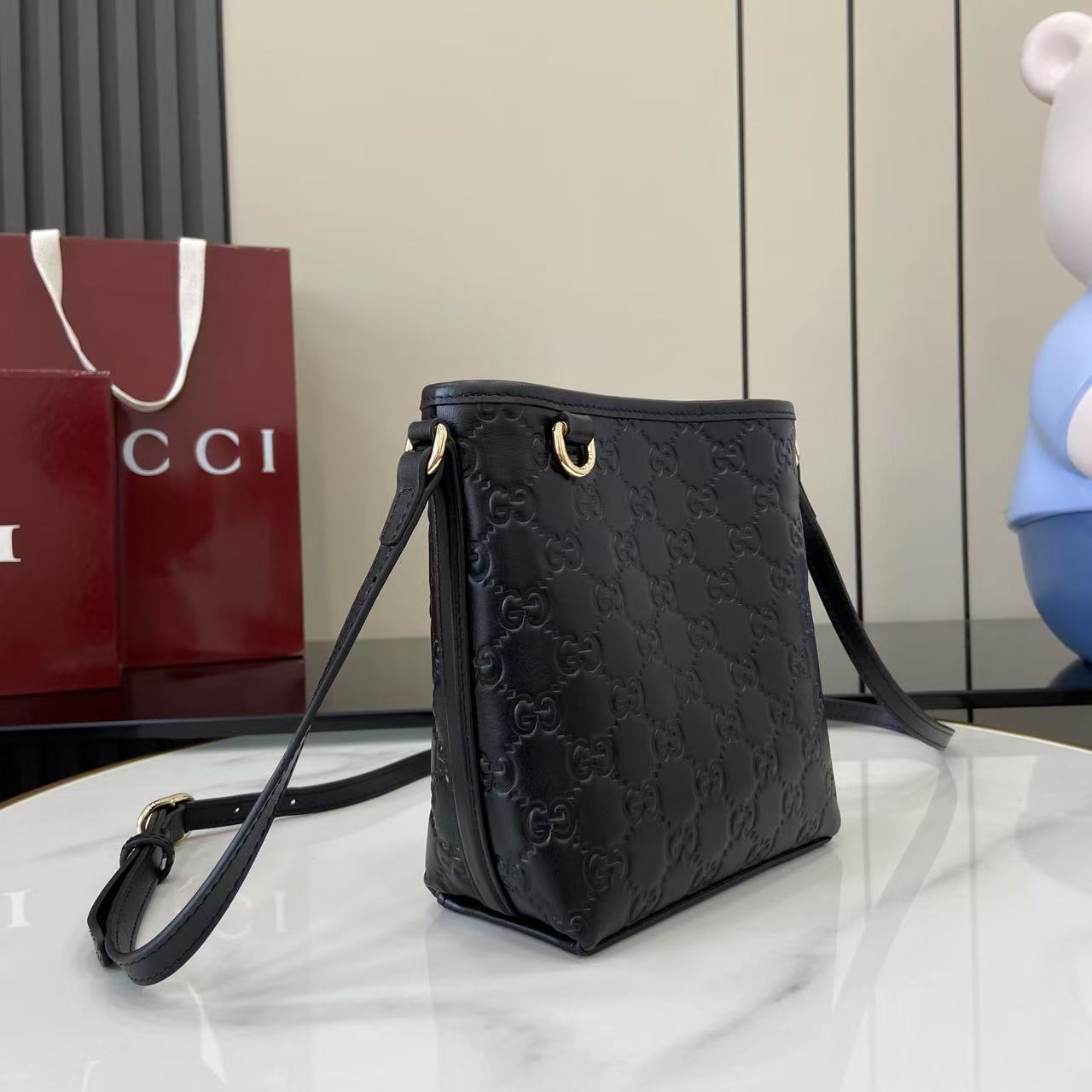 Gucci GG Emblem Nano Bucket Bag - FashionPlug