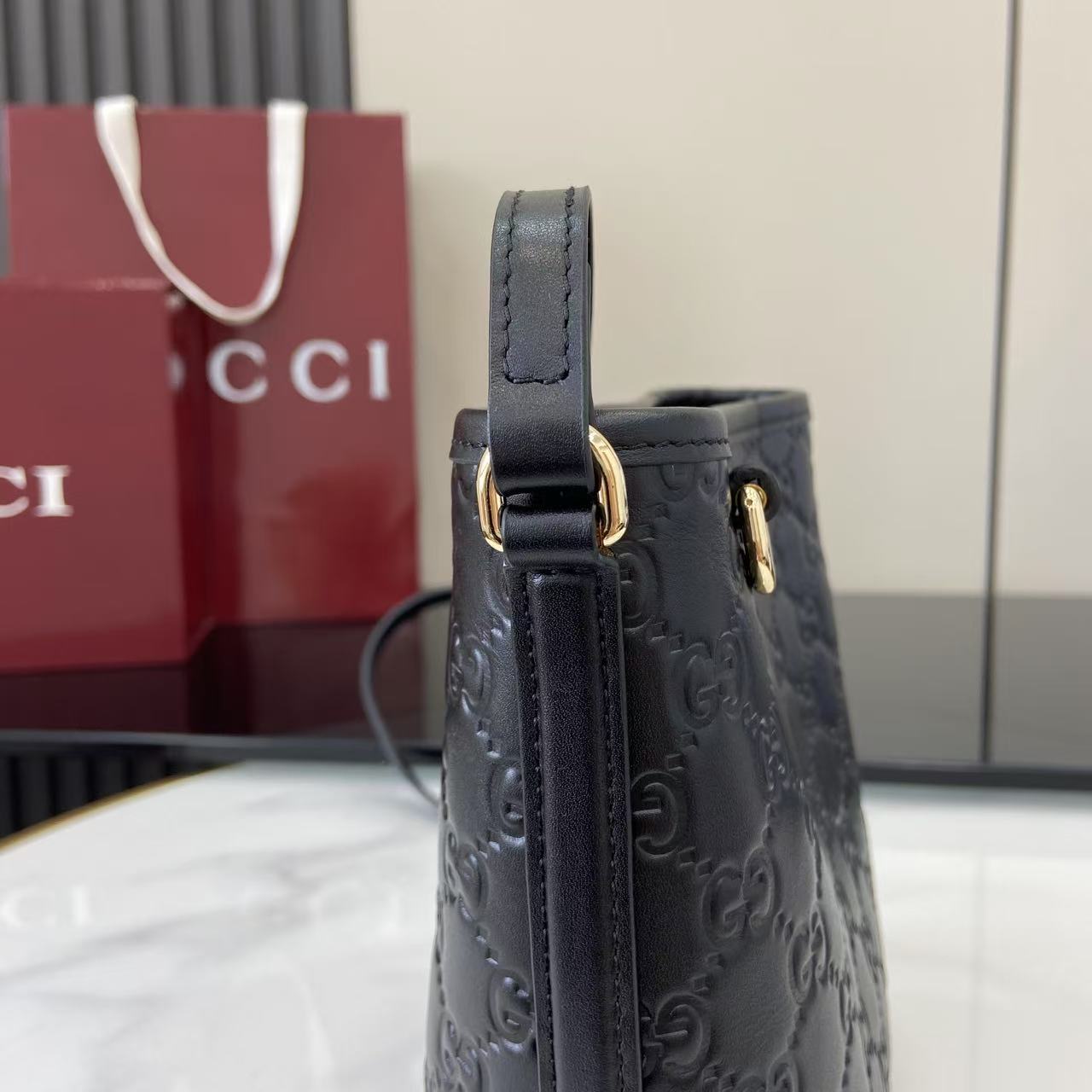 Gucci GG Emblem Nano Bucket Bag - FashionPlug