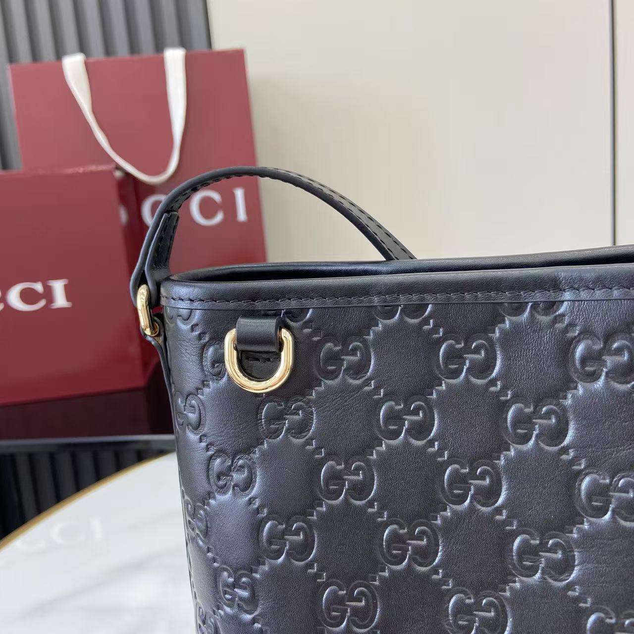 Gucci GG Emblem Nano Bucket Bag - FashionPlug