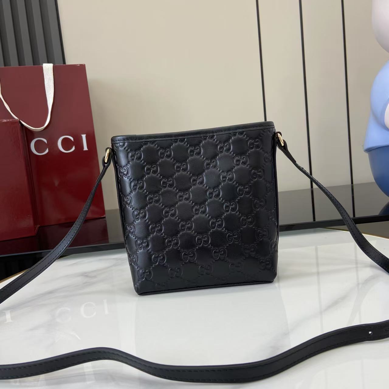 Gucci GG Emblem Nano Bucket Bag - FashionPlug