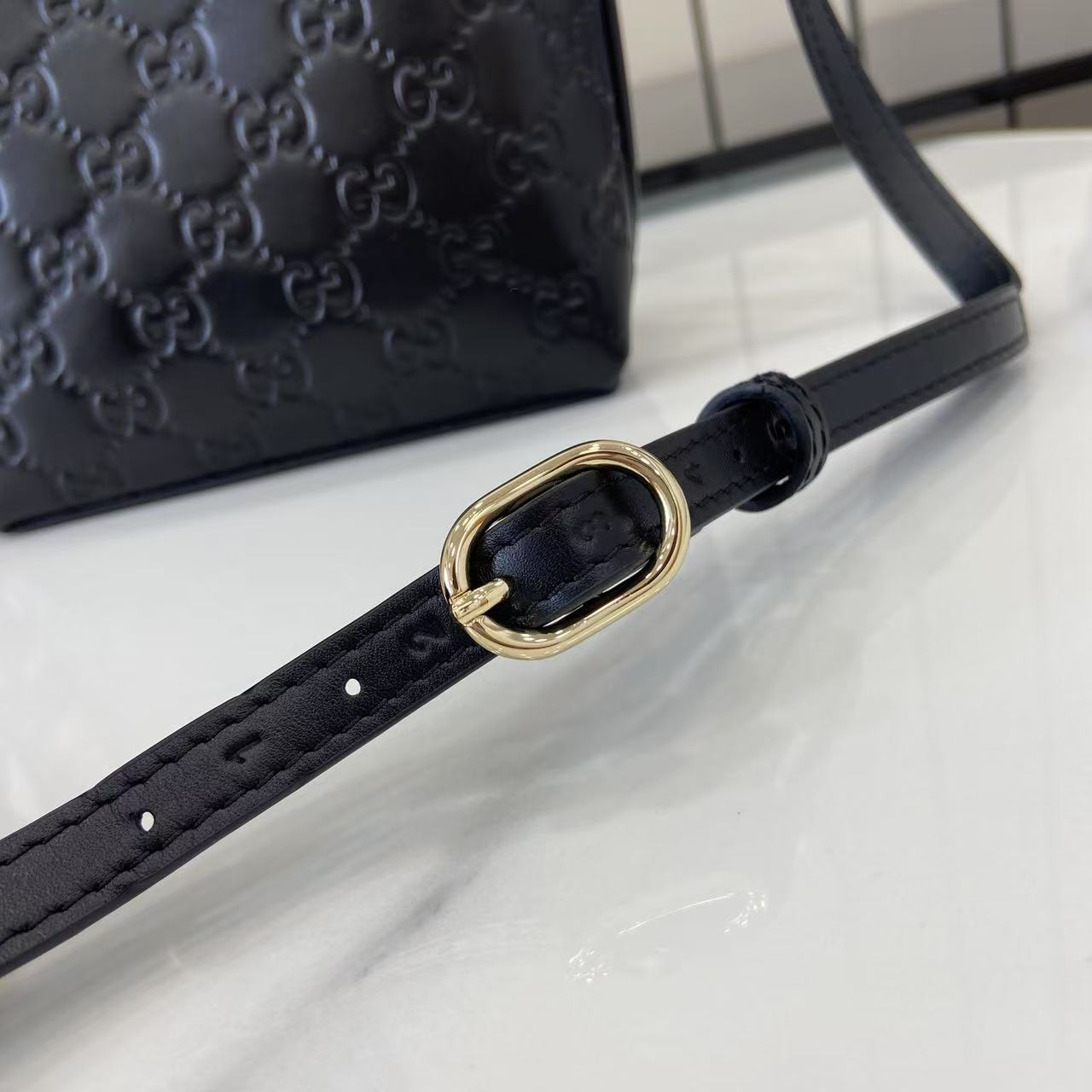 Gucci GG Emblem Nano Bucket Bag - FashionPlug