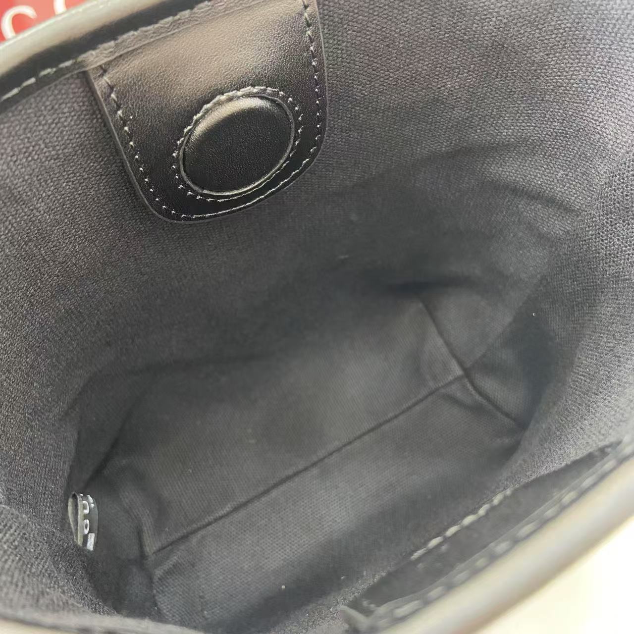 Gucci GG Emblem Nano Bucket Bag - FashionPlug