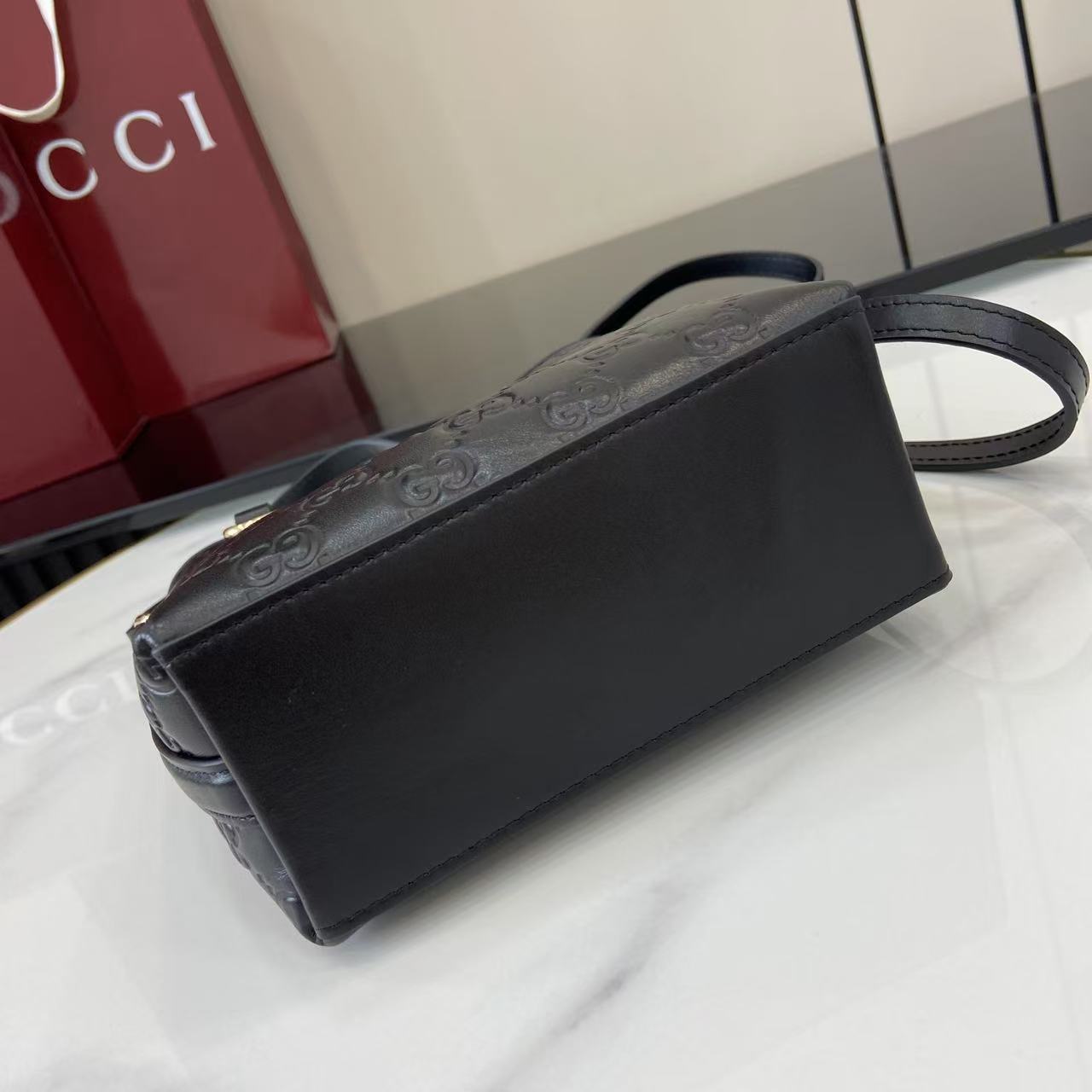 Gucci GG Emblem Nano Bucket Bag - FashionPlug