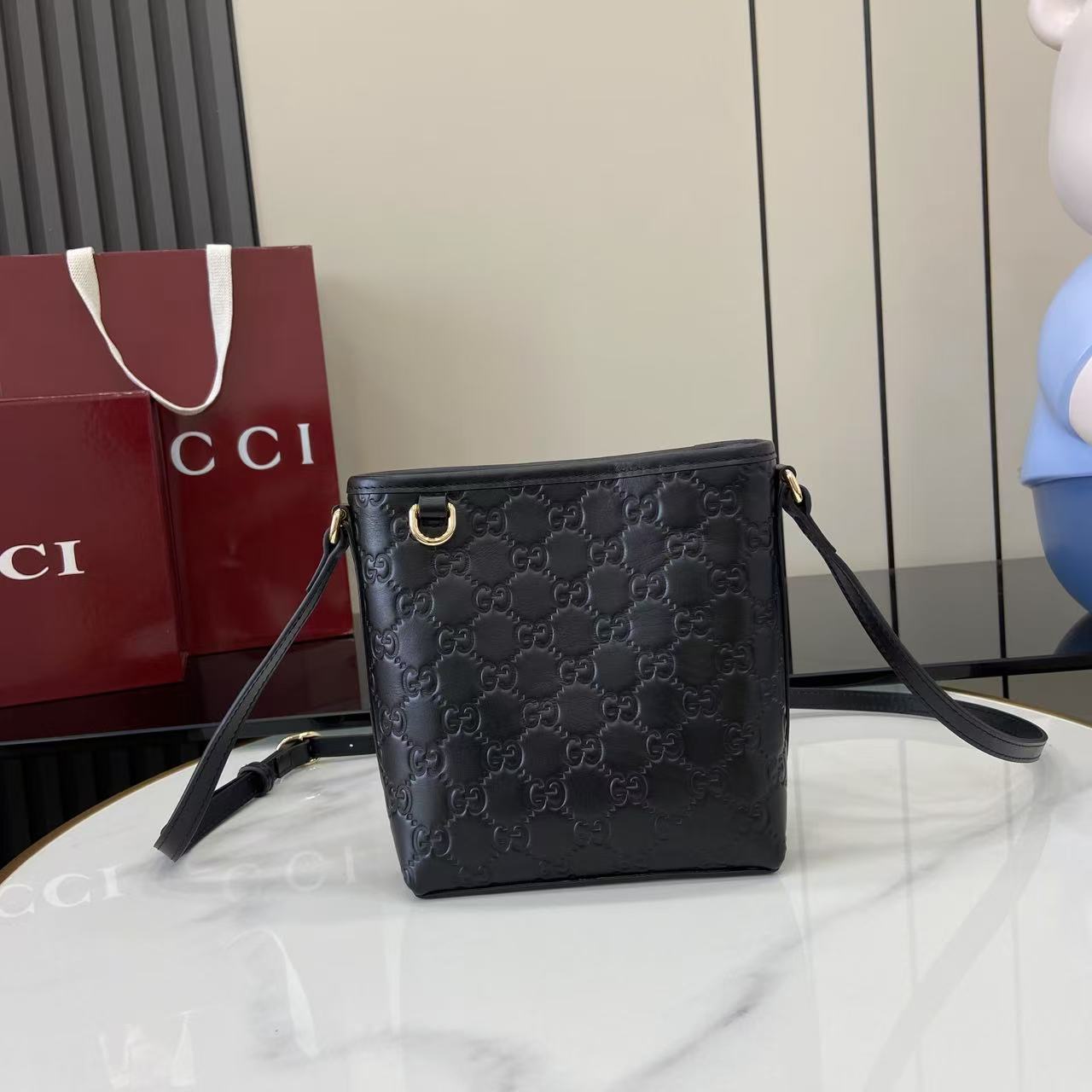 Gucci GG Emblem Nano Bucket Bag - FashionPlug