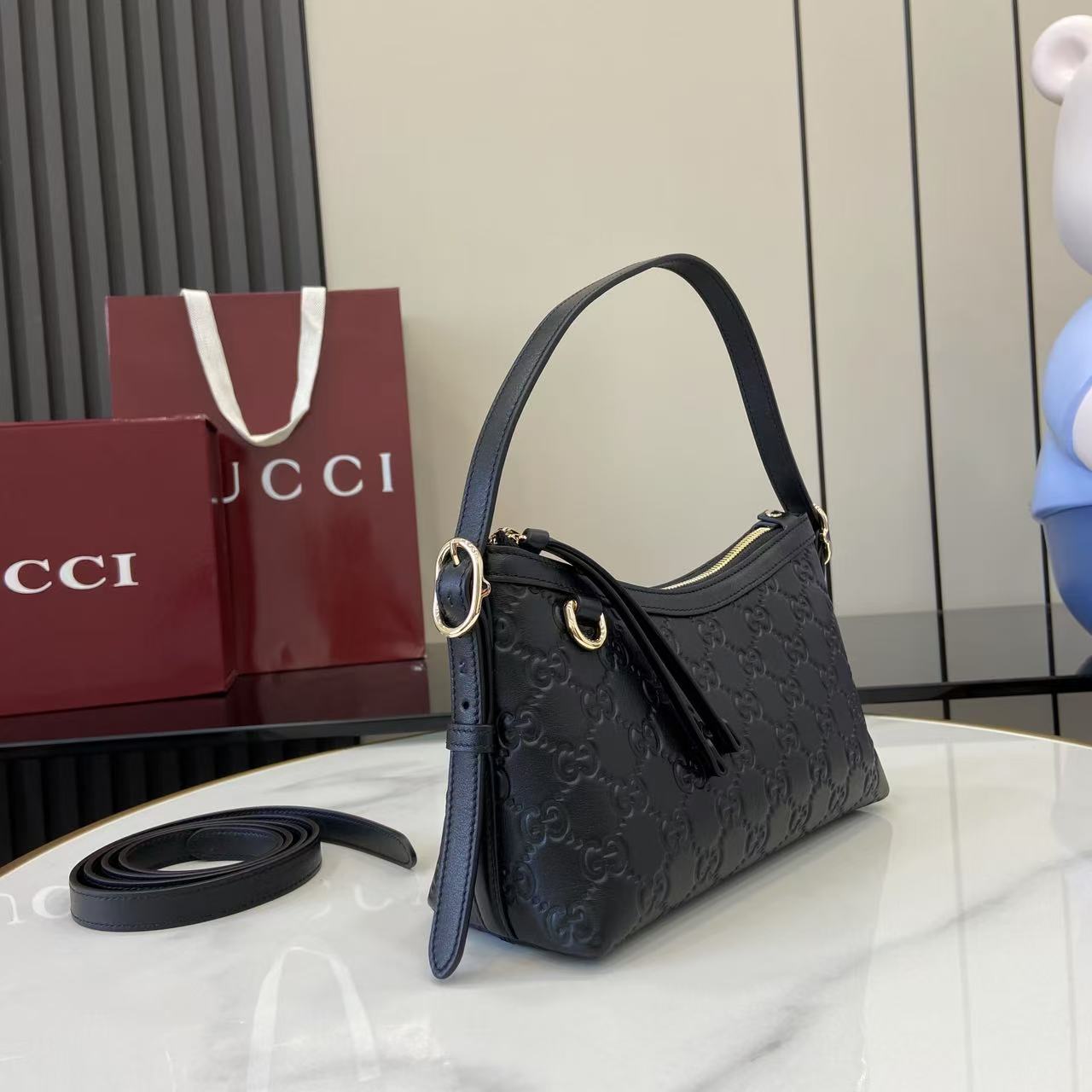 Gucci GG Emblem Small Shoulder Bag - FashionPlug