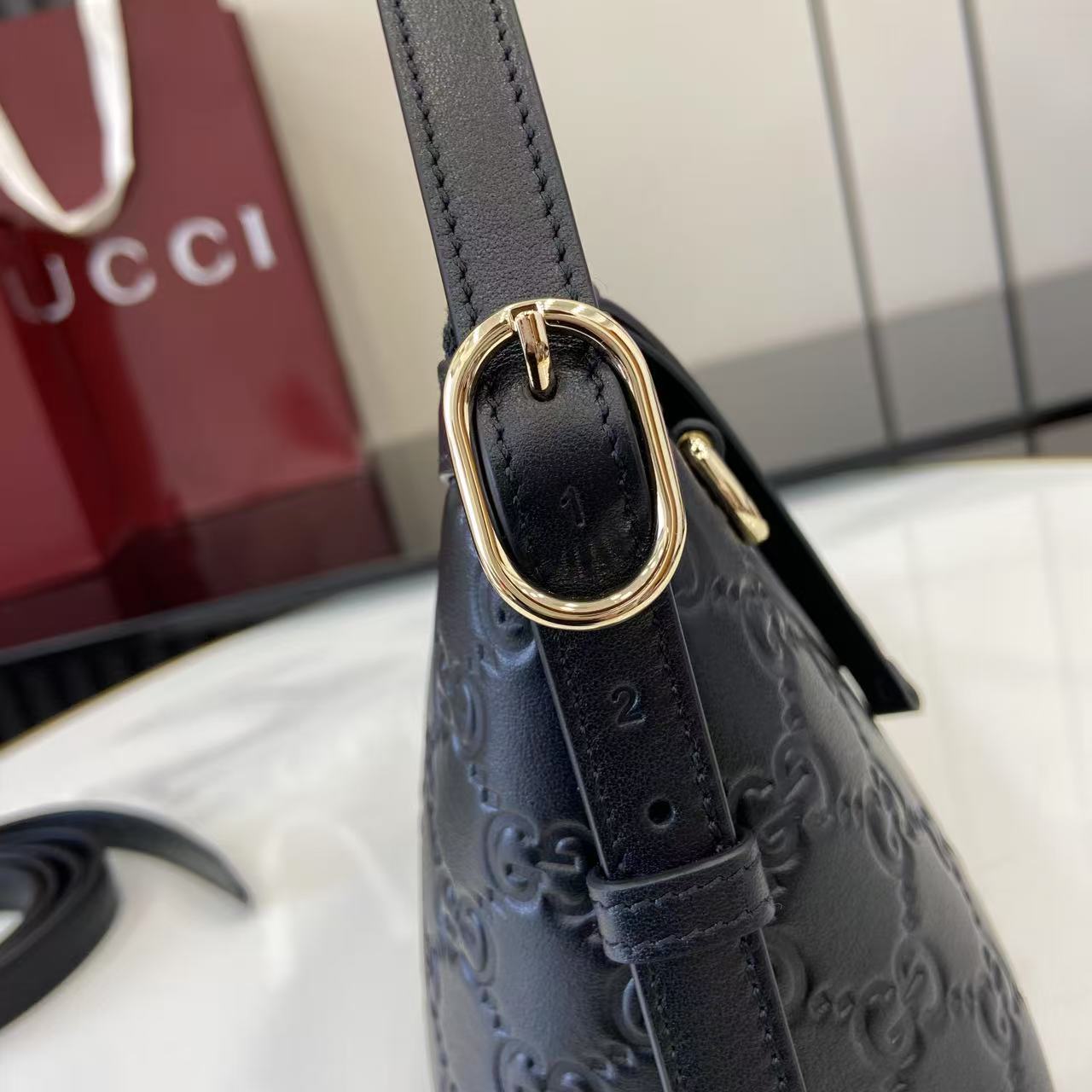 Gucci GG Emblem Small Shoulder Bag - FashionPlug