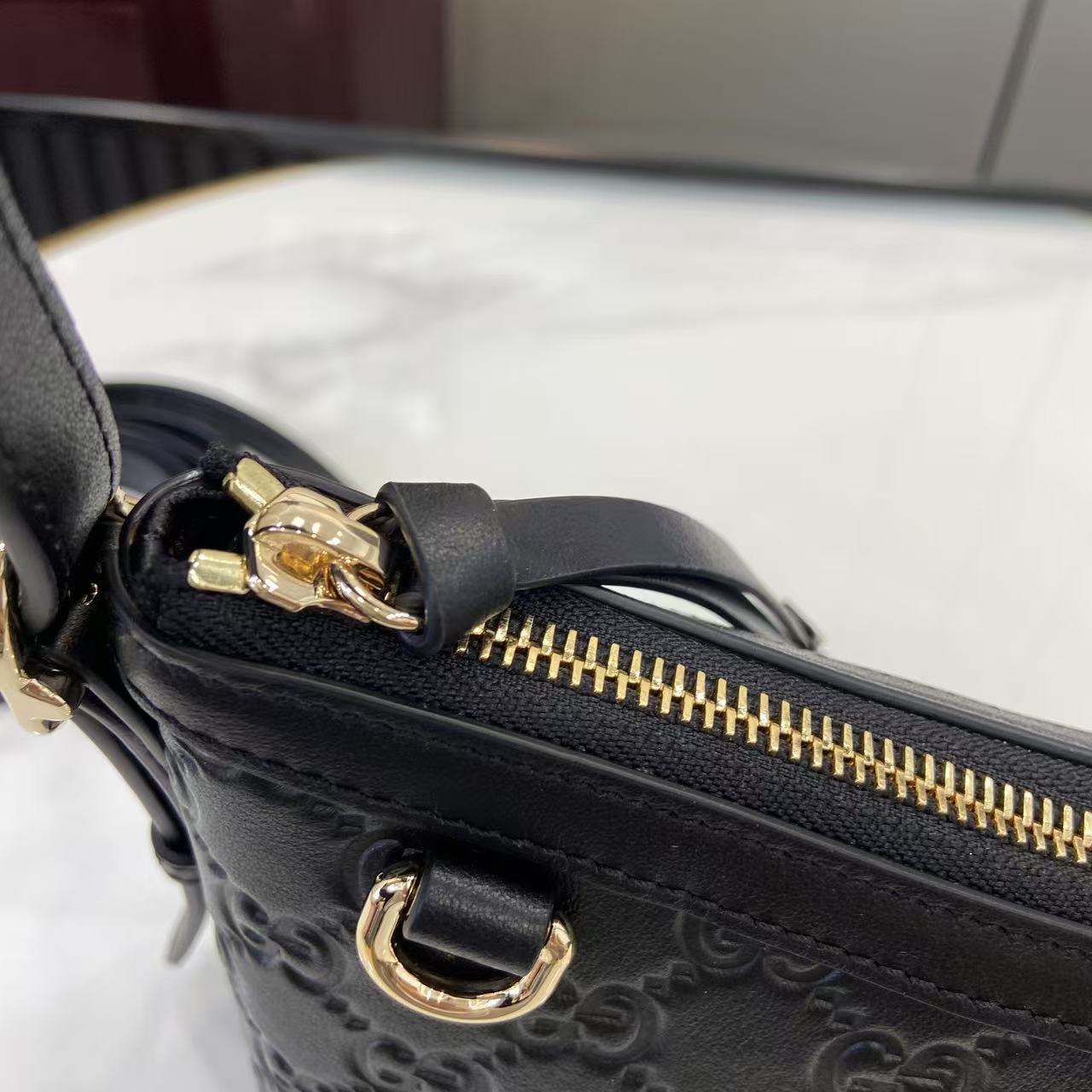 Gucci GG Emblem Small Shoulder Bag - FashionPlug