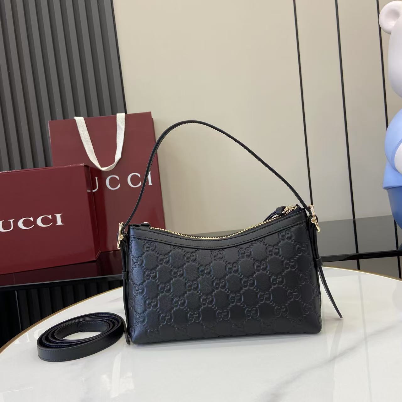 Gucci GG Emblem Small Shoulder Bag - FashionPlug
