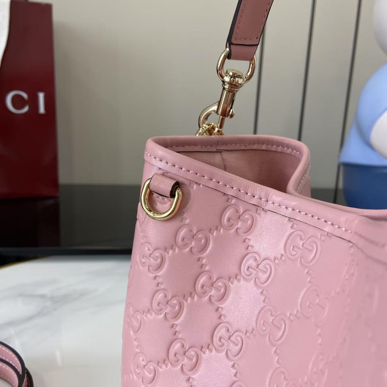 Gucci GG Emblem Nano Bucket Bag - FashionPlug