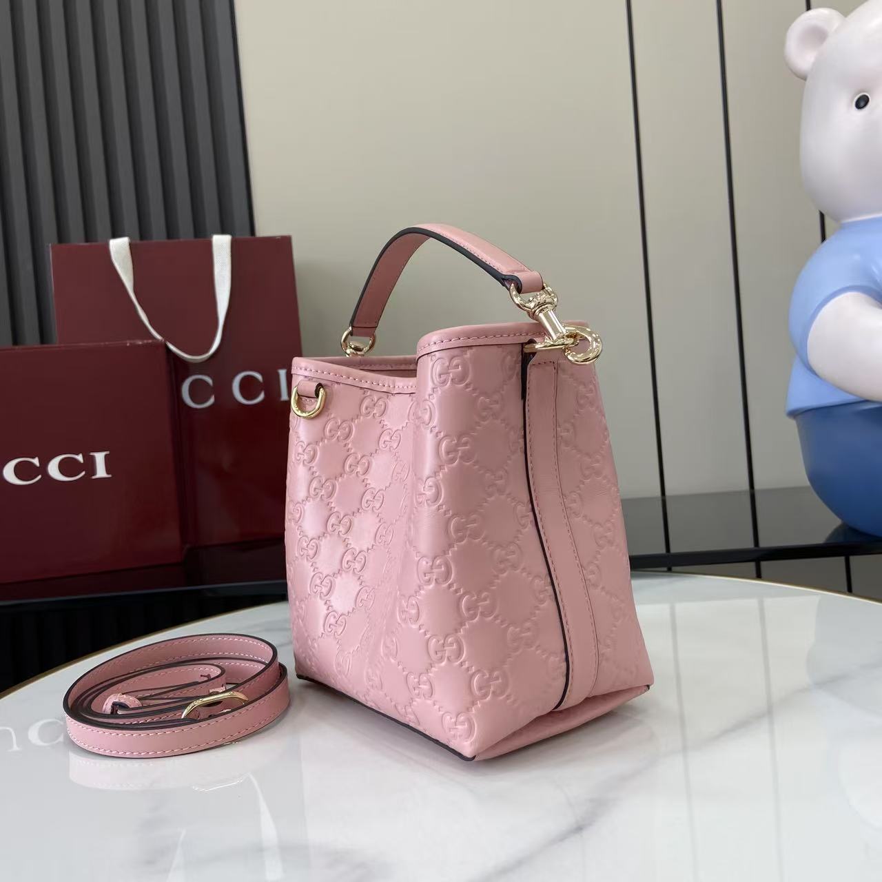 Gucci GG Emblem Nano Bucket Bag - FashionPlug