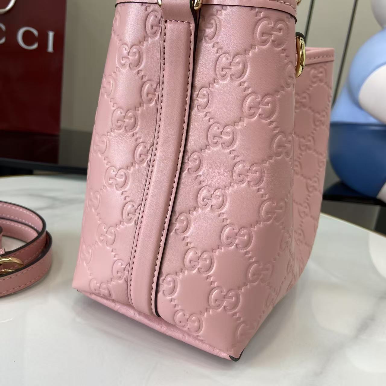 Gucci GG Emblem Nano Bucket Bag - FashionPlug