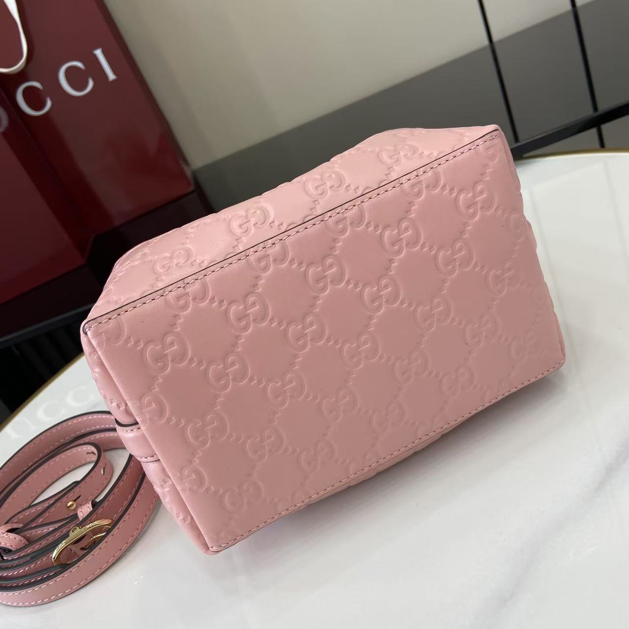 Gucci GG Emblem Nano Bucket Bag - FashionPlug