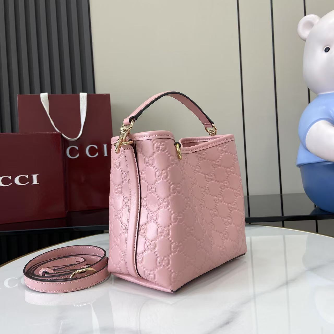 Gucci GG Emblem Nano Bucket Bag - FashionPlug