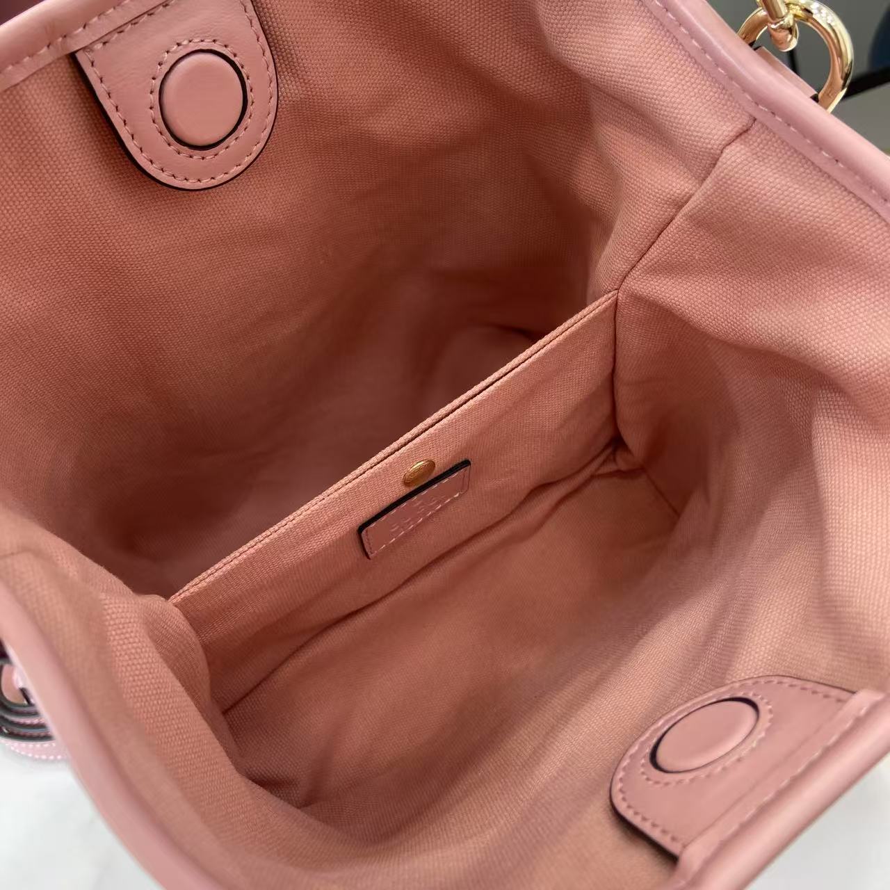 Gucci GG Emblem Nano Bucket Bag - FashionPlug