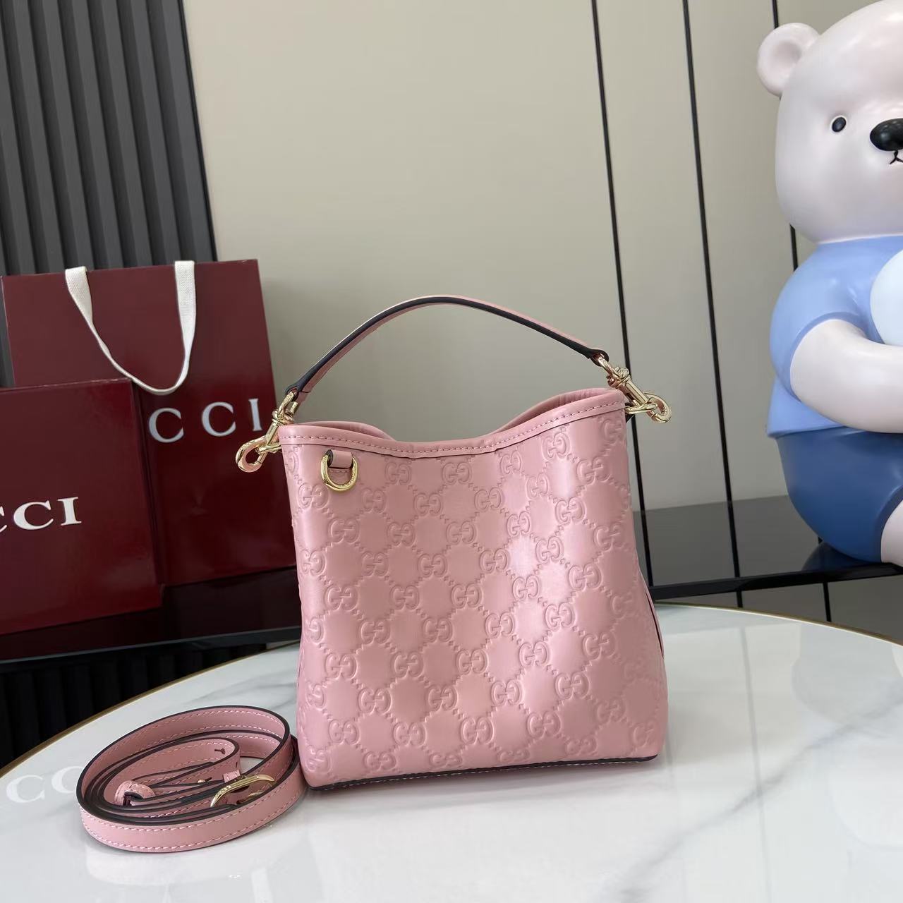 Gucci GG Emblem Nano Bucket Bag - FashionPlug
