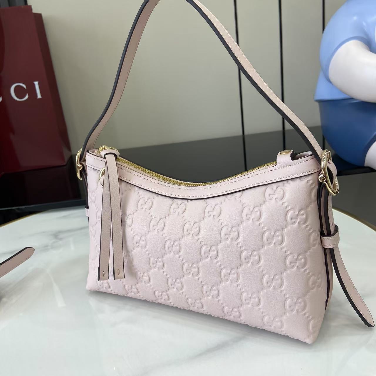 Gucci GG Emblem Small Shoulder Bag - FashionPlug