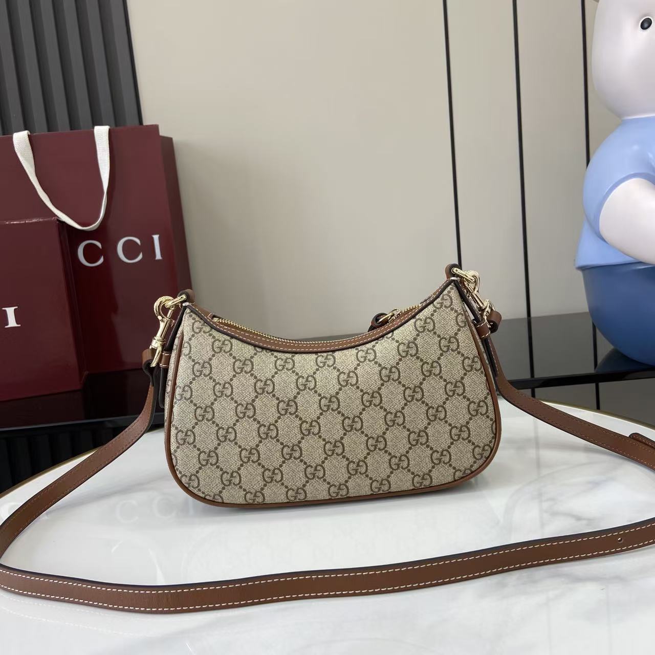 Gucci GG Emblem Small Shoulder Bag - FashionPlug