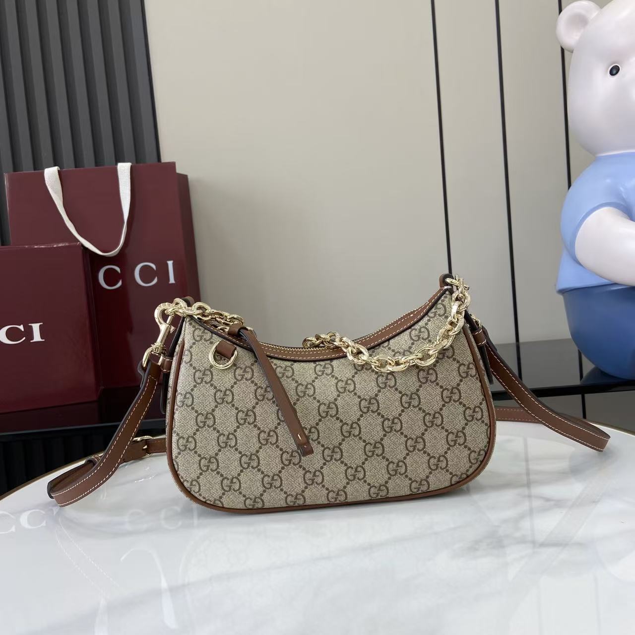 Gucci GG Emblem Small Shoulder Bag - FashionPlug