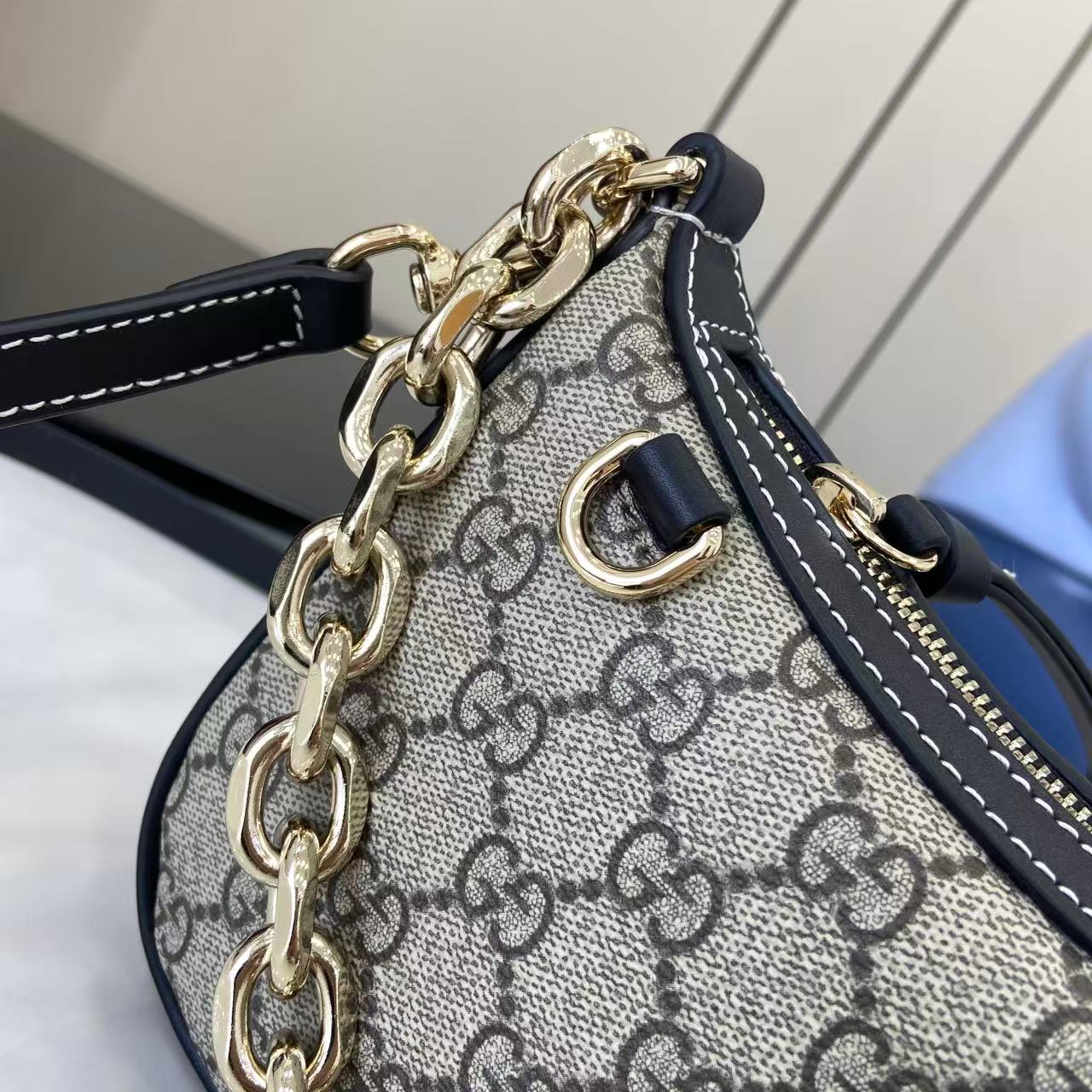 Gucci GG Emblem Small Shoulder Bag - FashionPlug