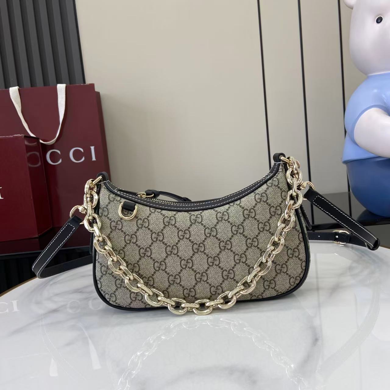 Gucci GG Emblem Small Shoulder Bag - FashionPlug