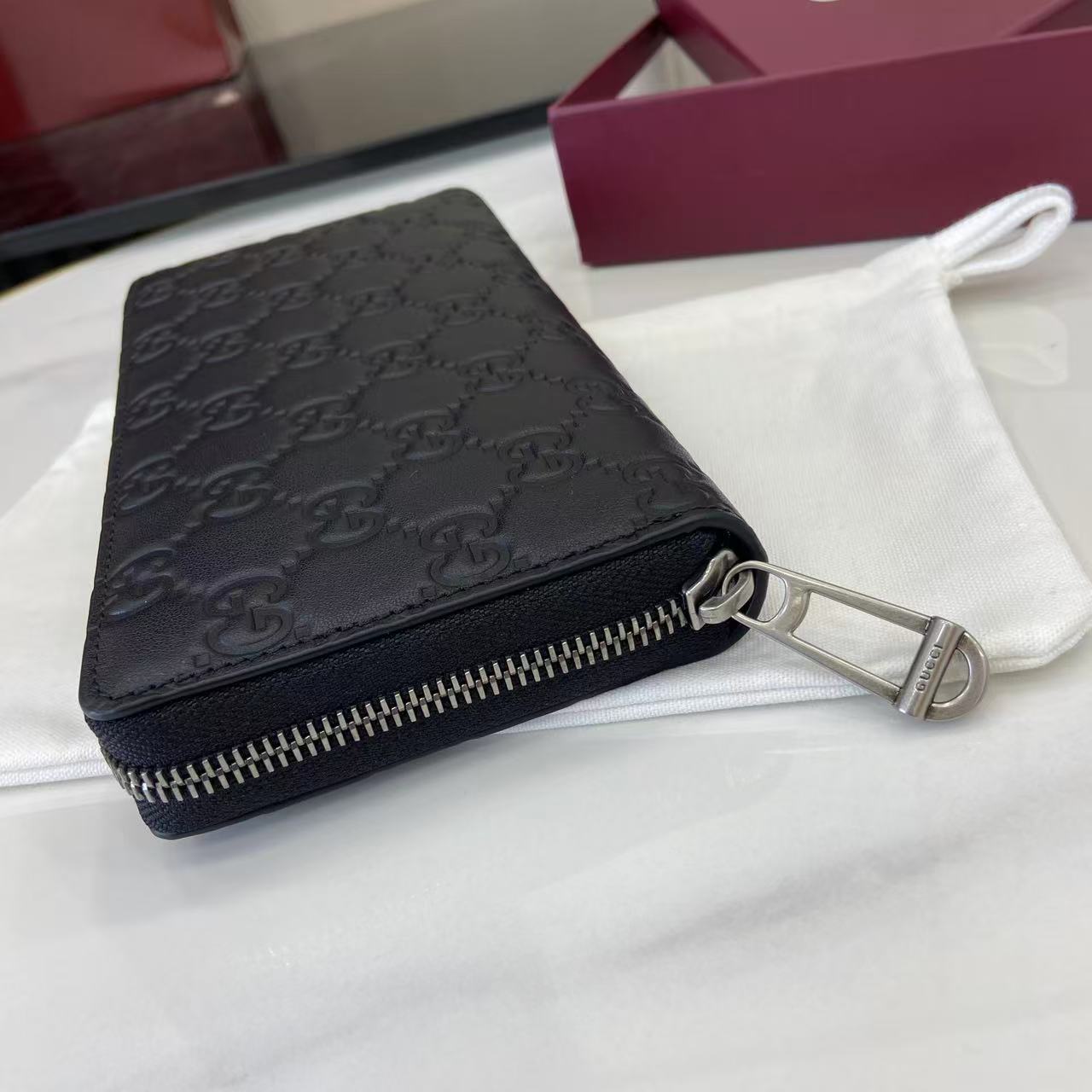 Gucci GG Emblem Zip Around Wallet - FashionPlug